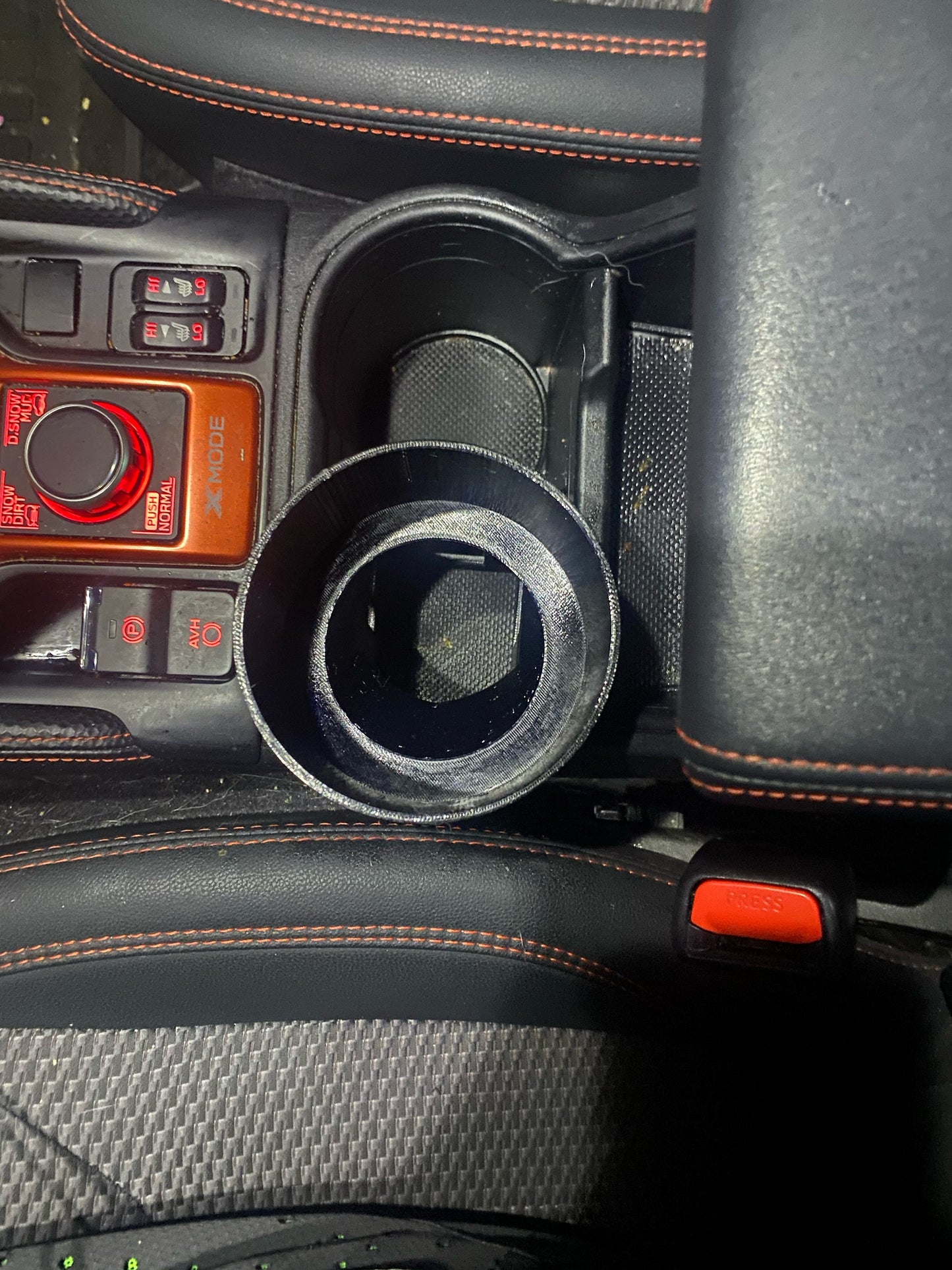 Top down view of cup holder adapter for the Subaru Forester (2019+) in the cup holder.